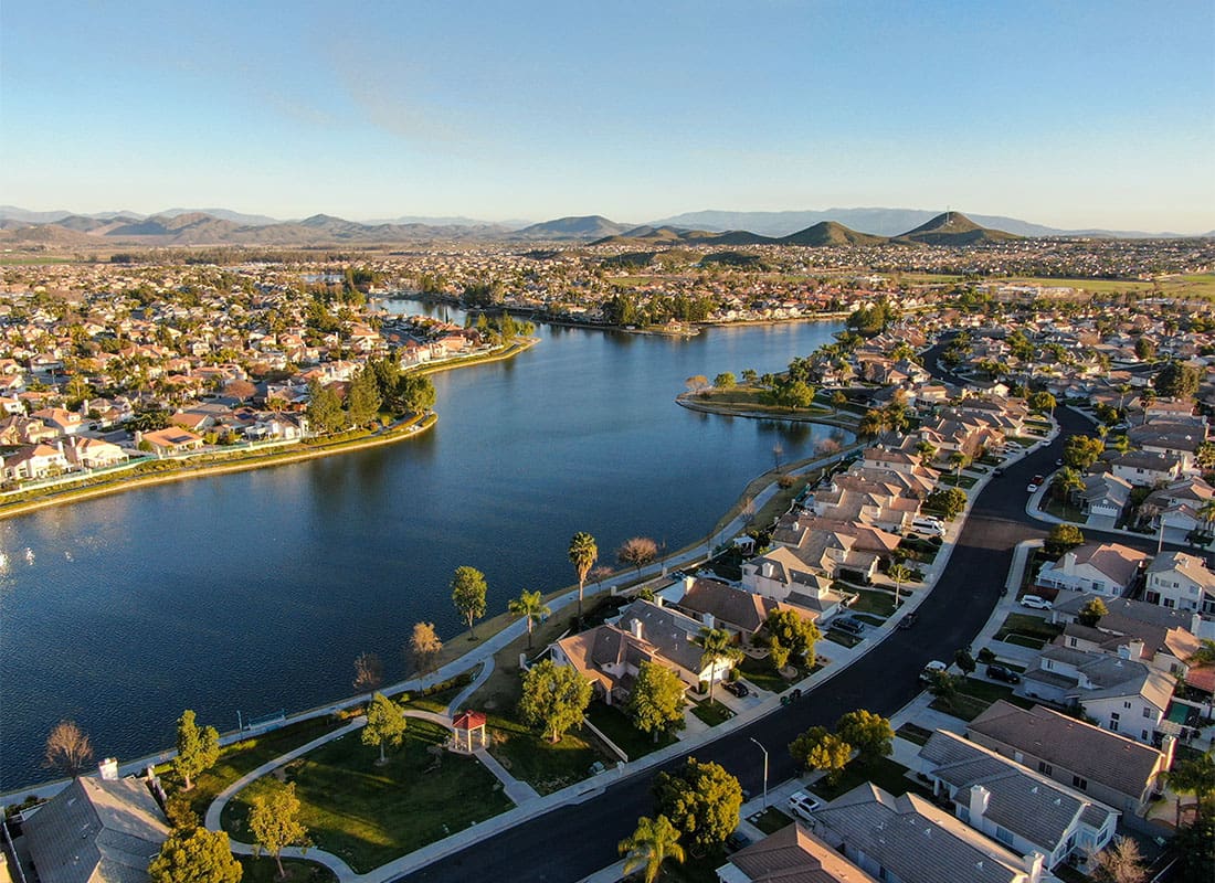 Insurance Solutions - Aerial View of a Residential Neighborhood in Riverside California with Homes by a Lake